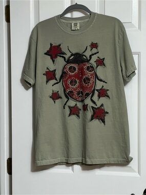 Comfort Colors Olive Short Sleeve Tee with Red Ladybug and Star Graphic
